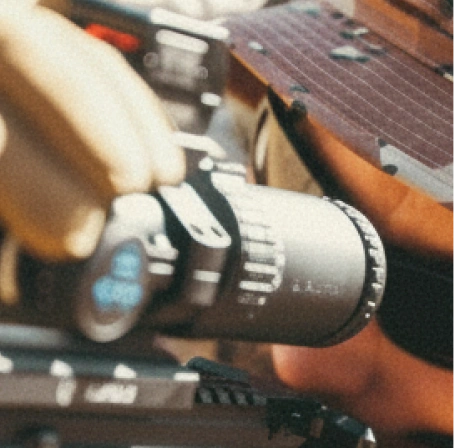 Composition of three close-up shots showing a shooter and pieces of equipment in 6-Color Desert camouflage